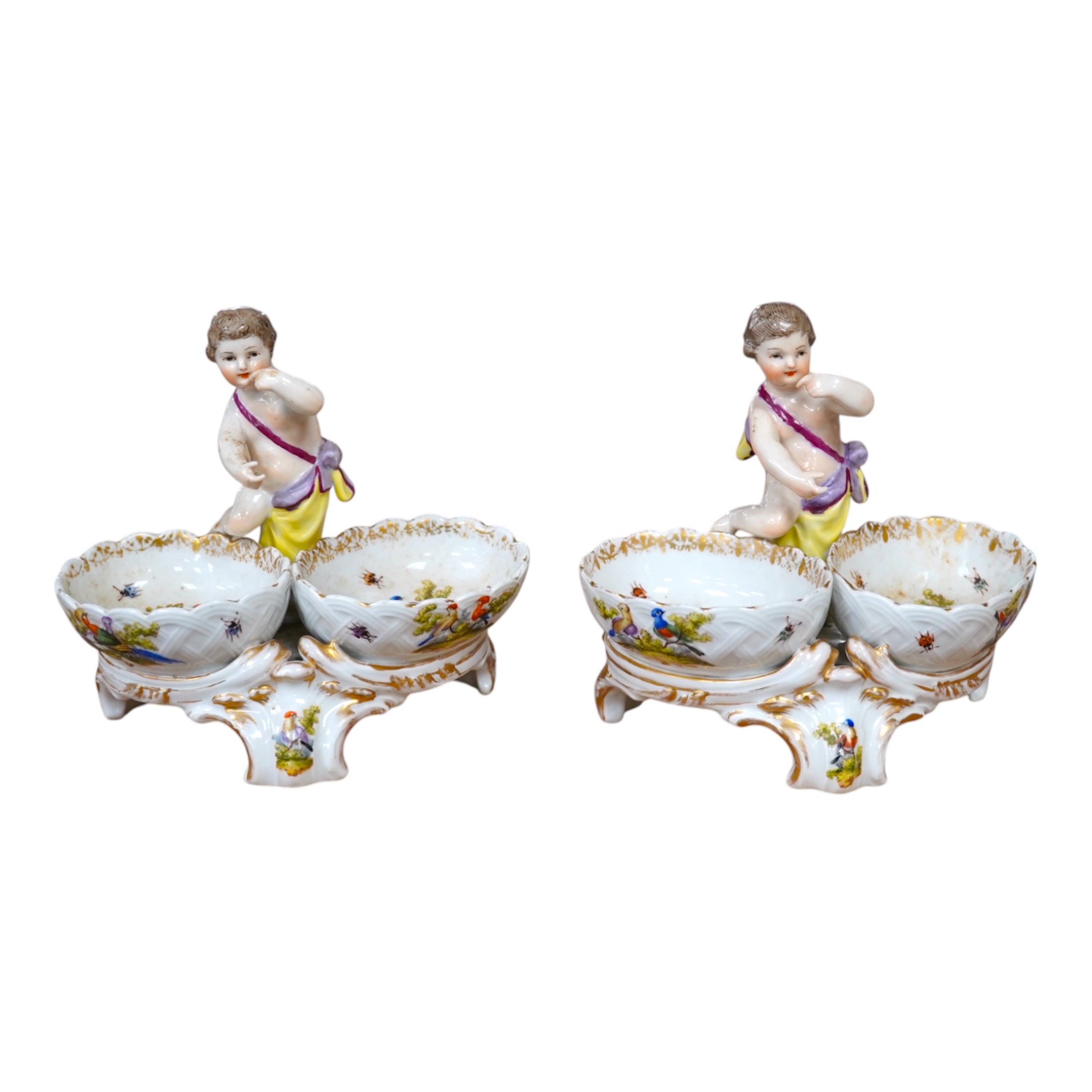 A pair of Berlin figural porcelain salts, hand painted with birds, 13.5cm wide. Condition - fair to good